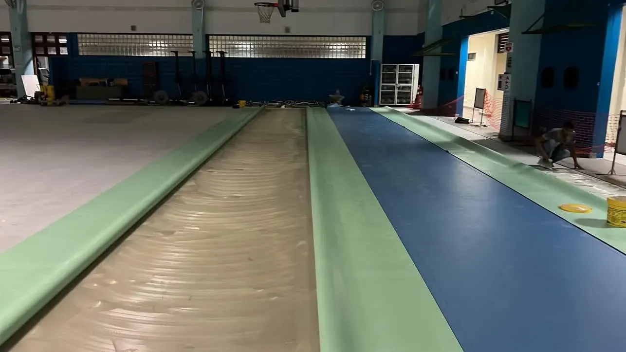 Sports floor system being installed over a prepared subfloor