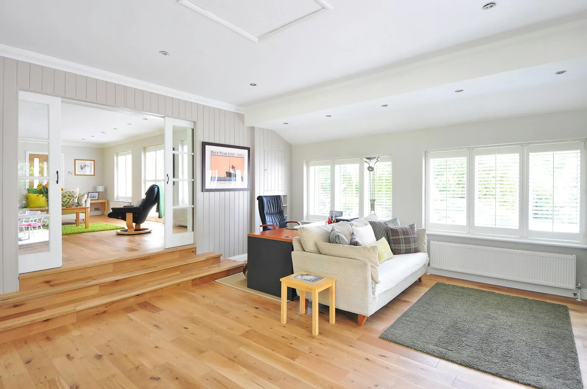 Wide-plank wooden flooring in a furnished living room
